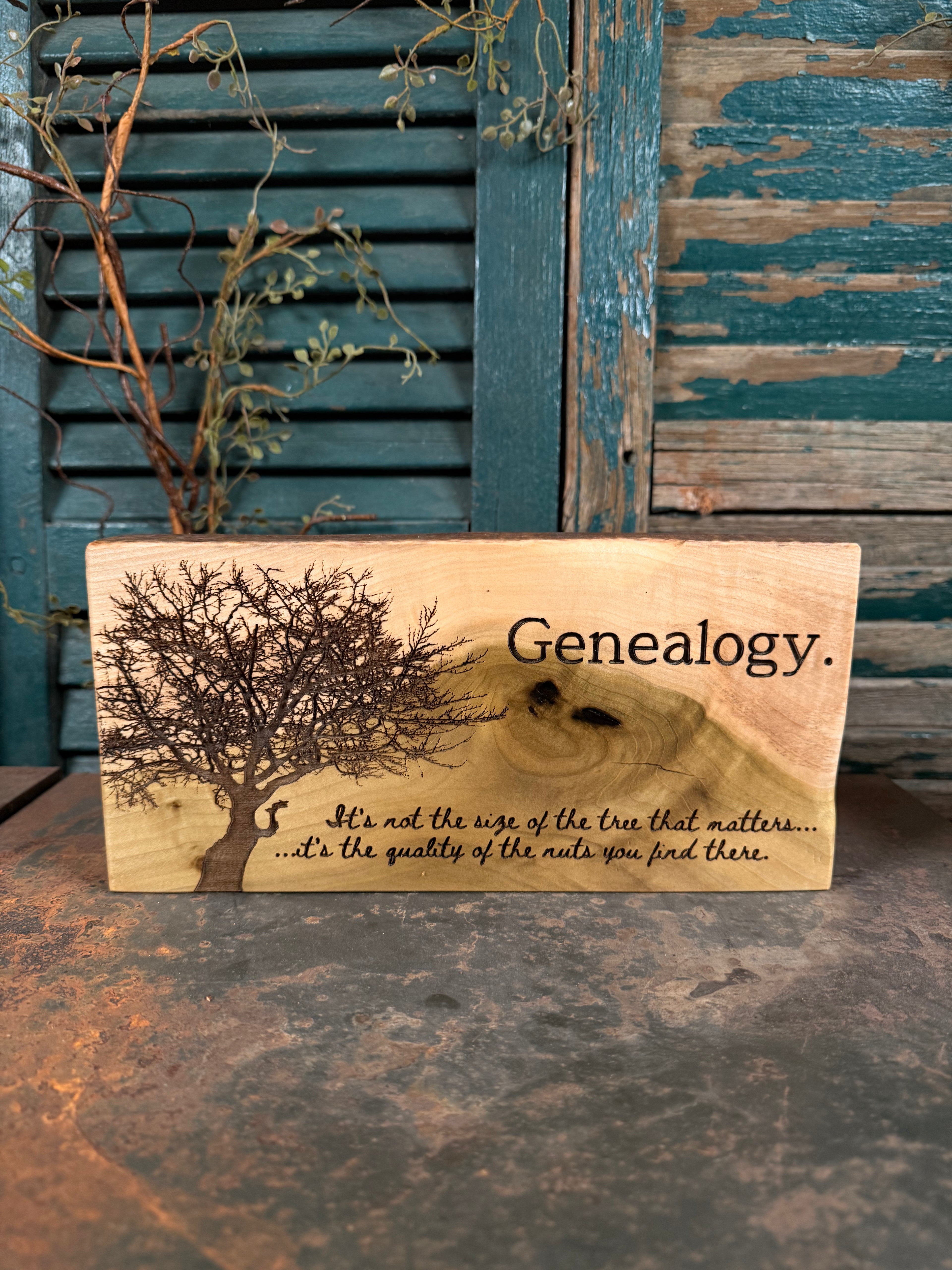 Wooden plaque with genealogy design and text against a rustic background